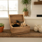 Handcrafted cremation urn for pets made from solid hardwood with open paw design and custom engraving options