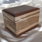 Handcrafted wooden urn for animal ashes with paw print design, made in Canada