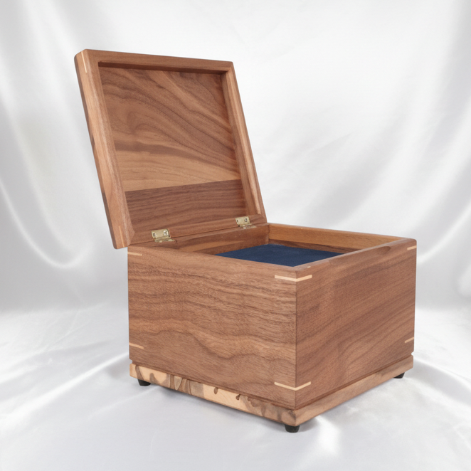 Handmade custom wooden urn shaped like a treasure chest, crafted in Canada