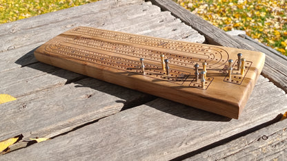Handcrafted Wood Cribbage Boards with peg storage. A practical gift for all occasions.