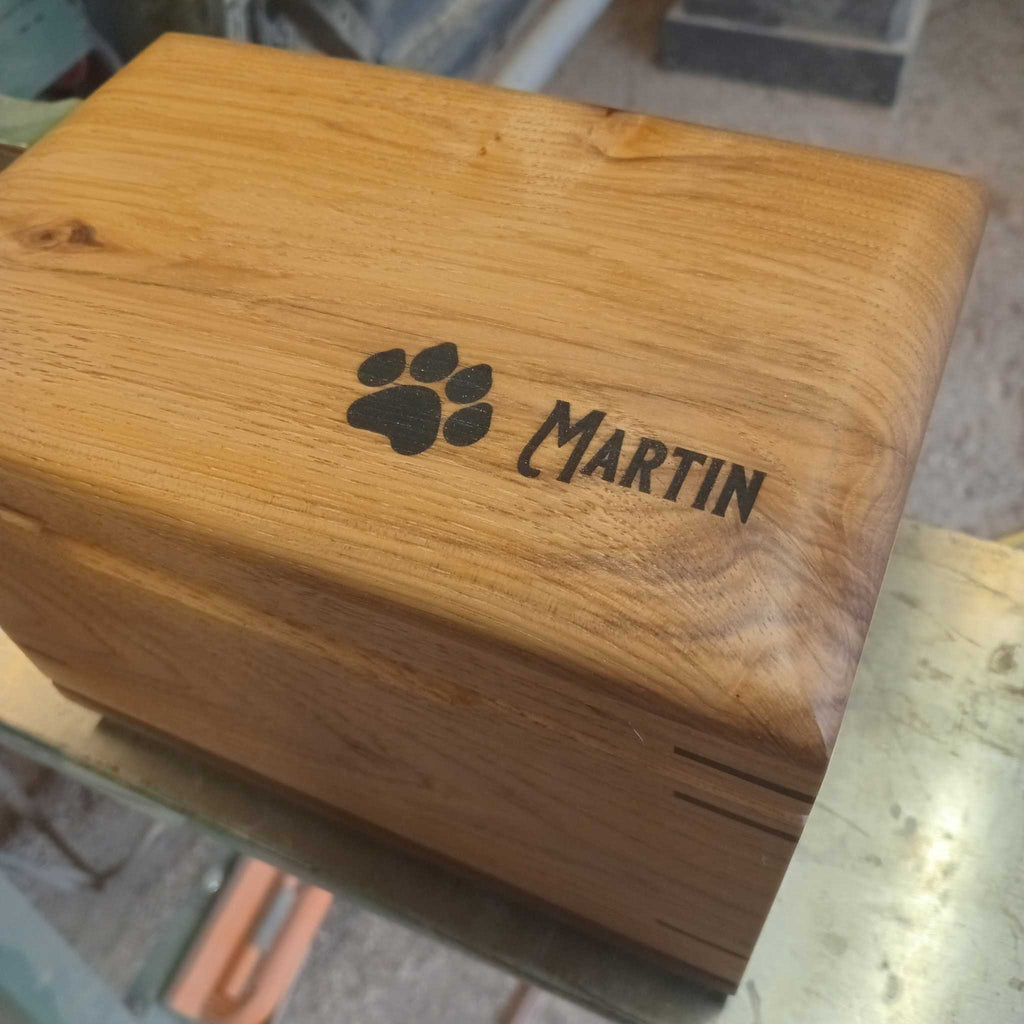 Handcrafted custom wood box urn with paw prints for pet ashes memorial