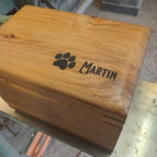 Handcrafted custom wood box urn with paw prints for pet ashes memorial